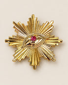 Broche Soleil Œil Strass Doré, packshot sur fond beige